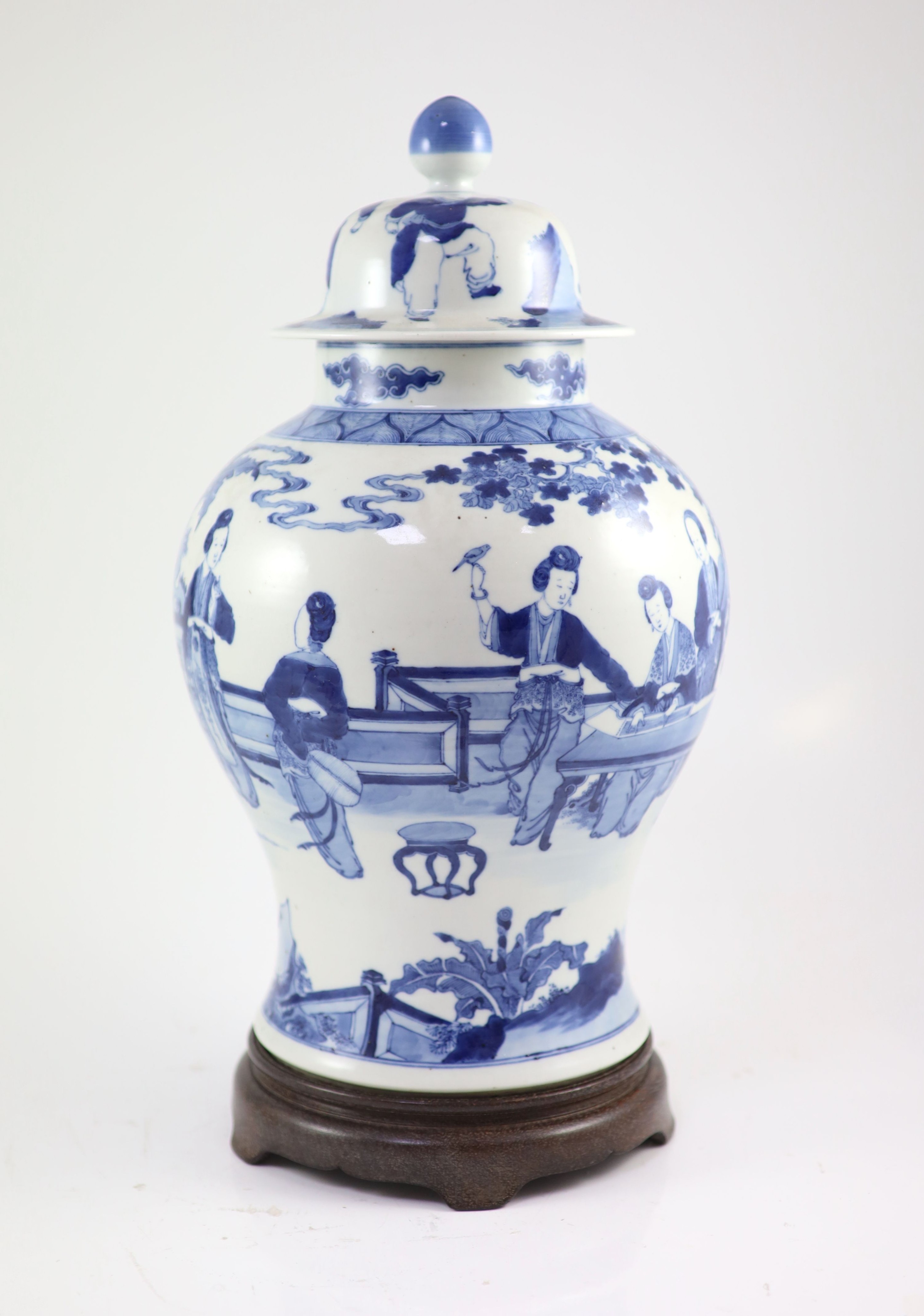 A large Chinese blue and white ‘ladies’ vase, Kangxi mark, 19th century, 44cm high, wood stand